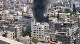The moment an Israeli air strike destroys a building in Gaza City