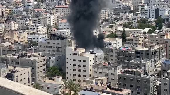 The moment an Israeli air strike destroys a building in Gaza City