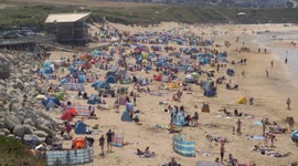 Thousands take to the beaches of Cornwall in SW England as UK heatwave returns