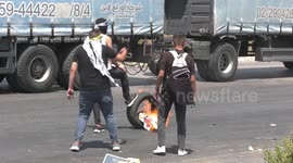 Palestinian protesters clash with Israeli troops at Gaza solidarity protest near West Bank's Beit El settlement