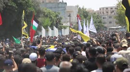 Huge crowds march at funerals for Palestinians killed by Israeli air strikes on Gaza
