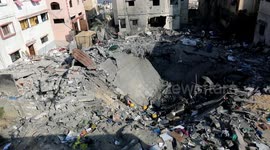 Palestinians inspect damage caused by Israeli airstrikes after truce is reached