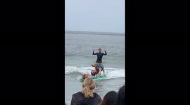 Adorable rescue pooches surf in tandem at World Dog Surfing Championships in US