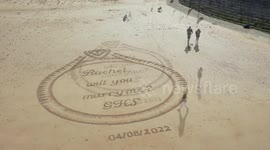 UK man proposes to girlfriend by carving giant picture of engagement ring on beach