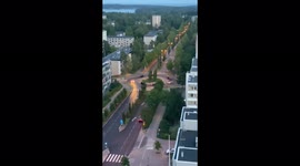 Cars performing some kind of ritual in a traffic circle in Espoo, Finland