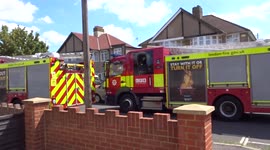 London Fire Brigade keep working in Feltham following woodland blaze on Hereford Road