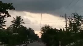 Long waterspout spotted during sunset in the Philippines