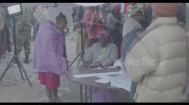 Kenyan Mother with her Child Registers to Cast her vote in Kenya's 2022 Elections
