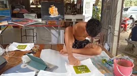 Inspirational disabled man without arms paints pictures for a living