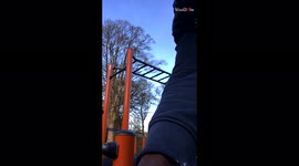 'Man expertly performs amazing calisthenics on monkey bars
'