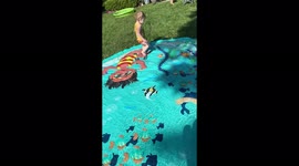 'Kid humorously fails while running on sprinkler splash pad
'