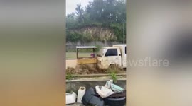Muddy flash floods wash away vehicles in the Philippines