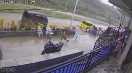 Raging muddy flood sweeps away parked vehicles during storm in the Philippines