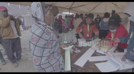 Kenyan Voter Registering and Collecting Voting Materials in Kenya's 2022 General Elections