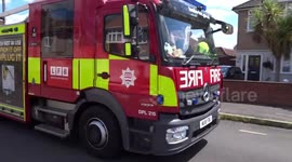 London Fire Brigade leaving Hereford Road after they saved 30 houses from woodland fire in Felham