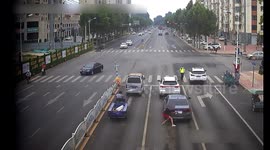 Chinese motorist removes towels covering licence plates just before police officer inspects vehicle