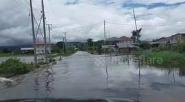 Heavy summer rains swamp village roads in Myanmar