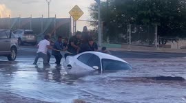 Firefighters rescue motorist from car falling into sinkhole in Texas