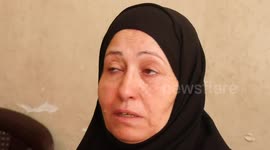 The Palestinian family of Diaa Al-Borai who was killed by an Israeli air strike mourn, in Jabalia