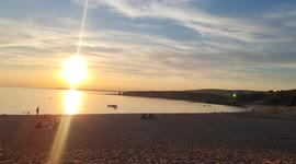 Heat wave 9pm on a Devon Beach loads of families having BBQs late in to the evening