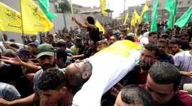 Palestinians carry the body of Ibrahim Abu Salah, who was killed by an Israeli air strike, during his funeral