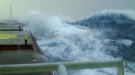 Huge waves crash against 12,000-tonne ship off France's west coast