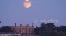 Spectacular nearly full Sturgeon Supermoon seen rising above historic Gatehouse in Kent, UK