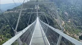 Tourists cross vertigo-inducing suspension bridge in Portugal