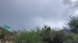 Flash flooding Tucon AZ. Flood waters wash out the road. flood destroys pavement.