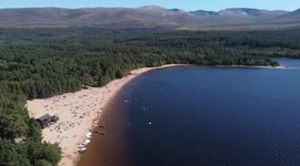 UK heatwave: Hundreds flock to Loch Morlich beach in Scottish Highlands
