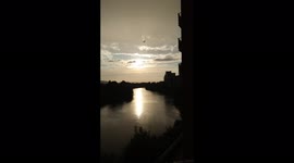 Simultaneous summer sun and rain over the River Taff in Cardiff, South Wales, UK