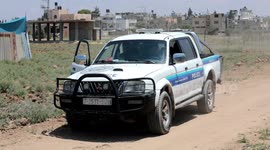 Palestinian bomb disposal experts remove remains of Israeli unexploded rockets that fell on an agricultural land during the latest fighting between Israel and Gaza