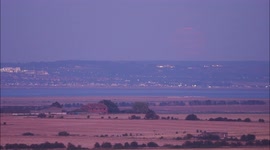 Stunning Sturgeon Supermoon seen rising over parched fields in Kent, UK