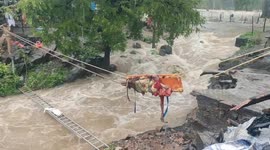 Elderly couple dangled over fast-flowing river during risky rescue mission in India