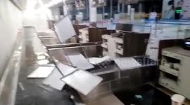Airport check-in desk ceiling collapses as rainwater pours into building in Honduras