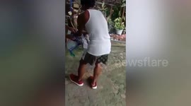 Resident catches king cobra hiding under sofa in the Philippines