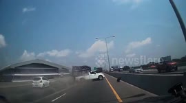 Overloaded pickup truck topples over on highway after its tire blew off