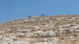 Palestinians take part in a demonstration against settlements in the village of Beit Dajan