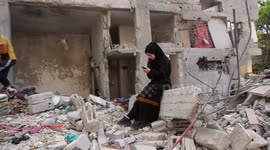 Palestinian woman Abeer Harb, fiancée of Ismail Dweik, who was killed by an Israeli air strike in latest fighting, inspects her home in Rafah