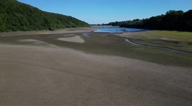 Dramatic drone video shows Leeds reservoir just a bed of cracked mud as it nearly dries up enntirely