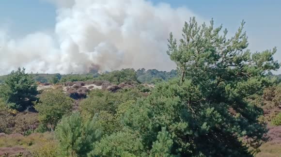 Massive heath fire near Studland, Dorset UK causing chaos for visitors to one of the UK's most beautiful beaches.
