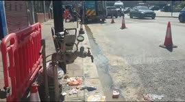 Workmen fix burst watermain in drought-hit south London as UK companies lose 2.4bn litres a day in leaks