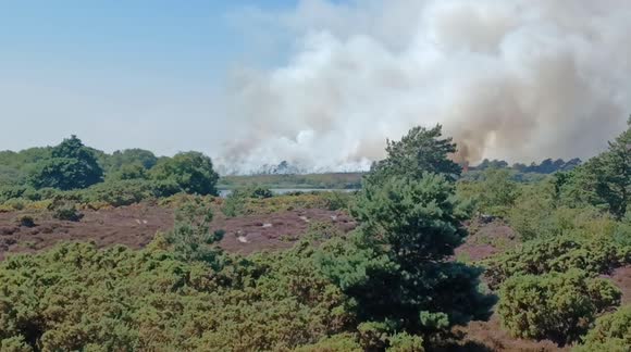 Massive heath fire near Studland, Dorset UK causing chaos for visitors to one of the UK's most beautiful beaches.