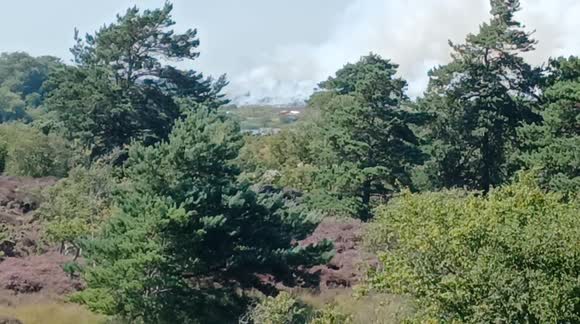 Massive heath fire near Studland, Dorset UK causing chaos for visitors to one of the UK's most beautiful beaches.