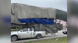 Wide load! Super-stacked pickup truck pulled over by police in Thailand