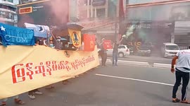 Angry protesters burn mannequin head with dictator Min Aung Hlaing's face tied onto it