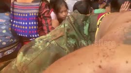 Trembling schoolchildren pray while hiding in foxhole as junta jets bombs village in Myanmar