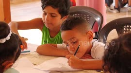 Palestinian children enjoy as part of the activities of the psychological discharge