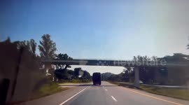 Cargo truck flips onto its side 'after driver falls asleep' on Thai highway