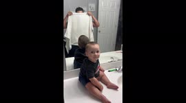 Dramatic baby boy BLATANTLY disapproves of dad's clean-shaven look